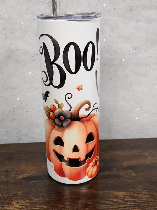 A Halloween Tumbler with a cute ghost and pumpkin design